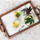 rectangular brown wooden tray filled with tea